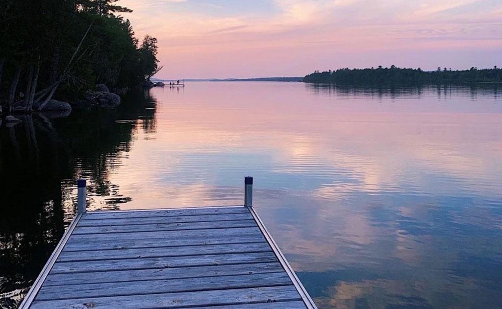 Photograph of a sunset over a lake.